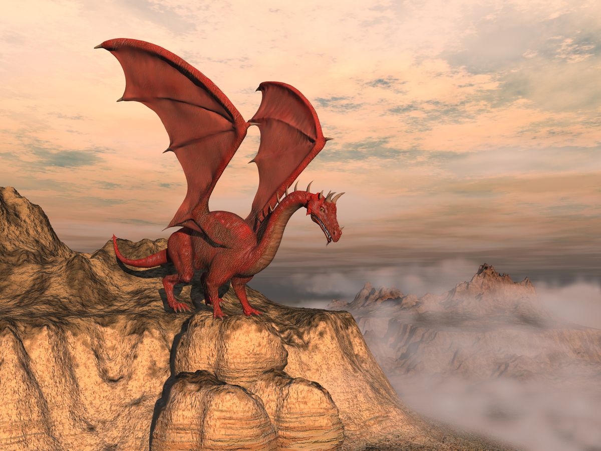 Red dragon sitting above a cliff with mist.