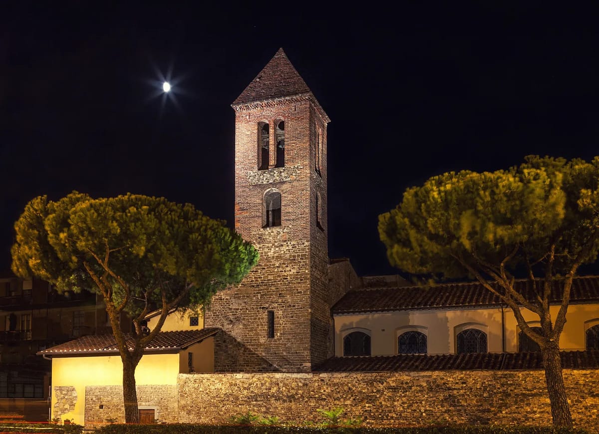 Some church building with trees at night